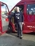 A photograph of a Handybus driver with the bus