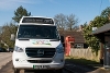 A picture of the Community Connect Thatcham Connect bus by a bus stop at Chapel Row.