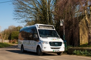 A picture of the West Berkshire Community Connect vehicle parked at bus stop. 