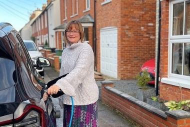 16 Powering up progress woman charging car